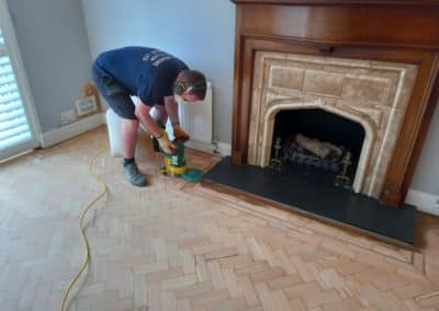 Peter Andrews Wood Floor Specialist Ltd sanding a floor